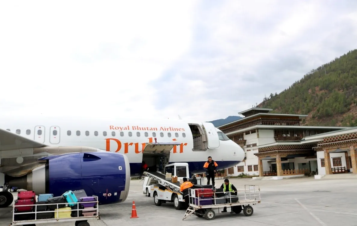 A Drukair Royal Bhutan Airlines aircraft being loaded at Paro International Airport
